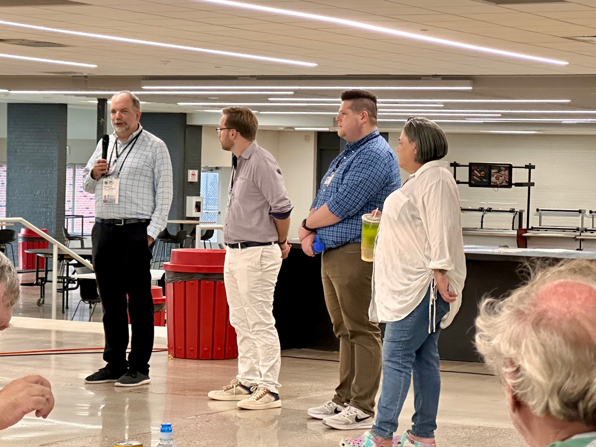 Alder Fields, Alder O'Brien, and officials address attendees at the open house