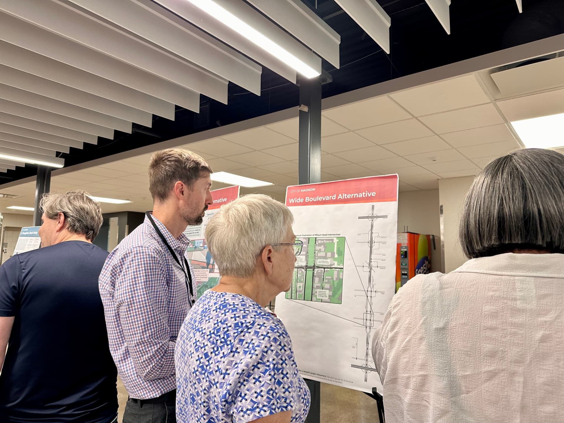 Residents review the Wide Boulevard Alternative display board
